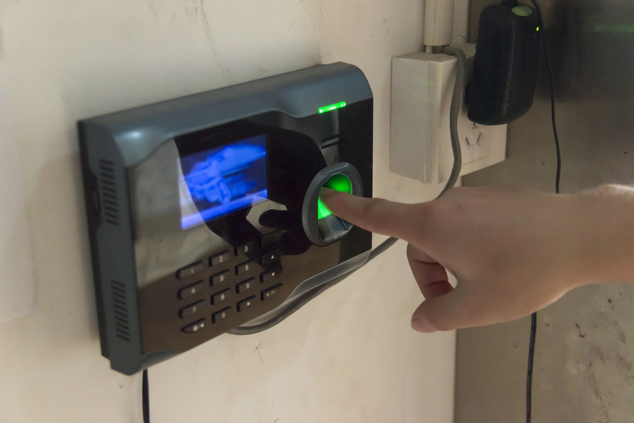 A person is touching the finger on an electronic device.